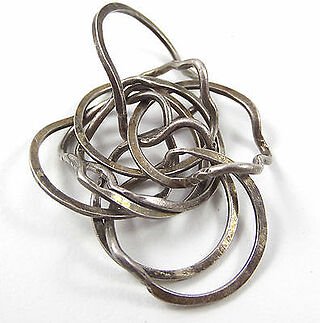 Puzzle-ring-very-difficult-to-put-back-together-once-removed.jpg